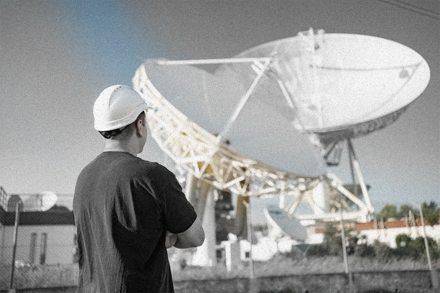 A image of a concrete sphere, balanced between two other larger spheres